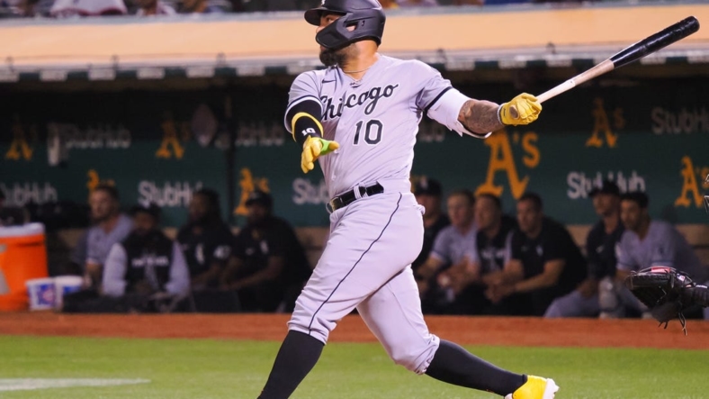 Sep 8, 2022; Oakland, California, USA; Chicago White Sox third baseman Yoan Moncada (10) hits an RBI double against the Oakland Athletics during the fifth inning at RingCentral Coliseum. Mandatory Credit: Kelley L Cox-USA TODAY Sports