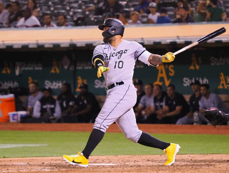 Sep 8, 2022; Oakland, California, USA; Chicago White Sox third baseman Yoan Moncada (10) hits an RBI double against the Oakland Athletics during the fifth inning at RingCentral Coliseum. Mandatory Credit: Kelley L Cox-USA TODAY Sports