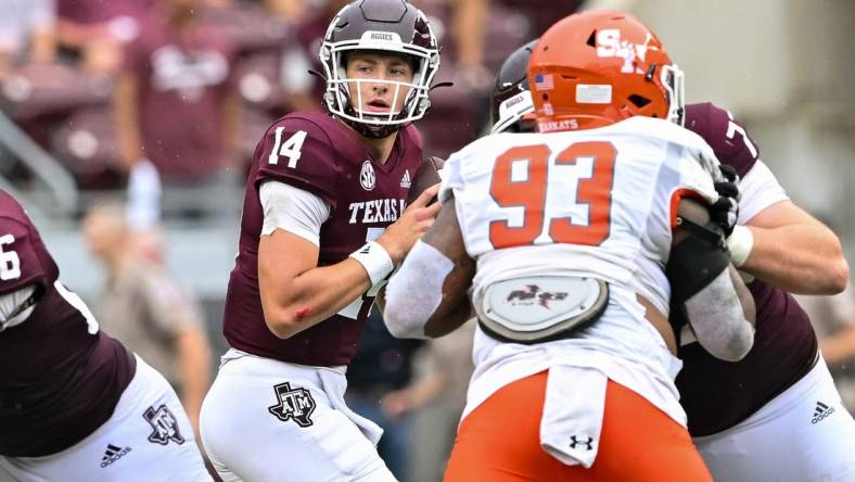 Sep 3, 2022; College Station, Texas, USA;  Texas A&M Aggies quarterback Max Johnson (14) throws the ball against the Sam Houston State Bearkats at Kyle Field. Mandatory Credit: Maria Lysaker-USA TODAY Sports