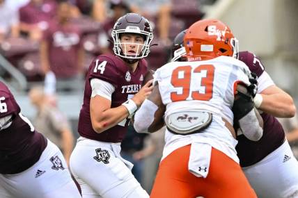 Sep 3, 2022; College Station, Texas, USA;  Texas A&M Aggies quarterback Max Johnson (14) throws the ball against the Sam Houston State Bearkats at Kyle Field. Mandatory Credit: Maria Lysaker-USA TODAY Sports