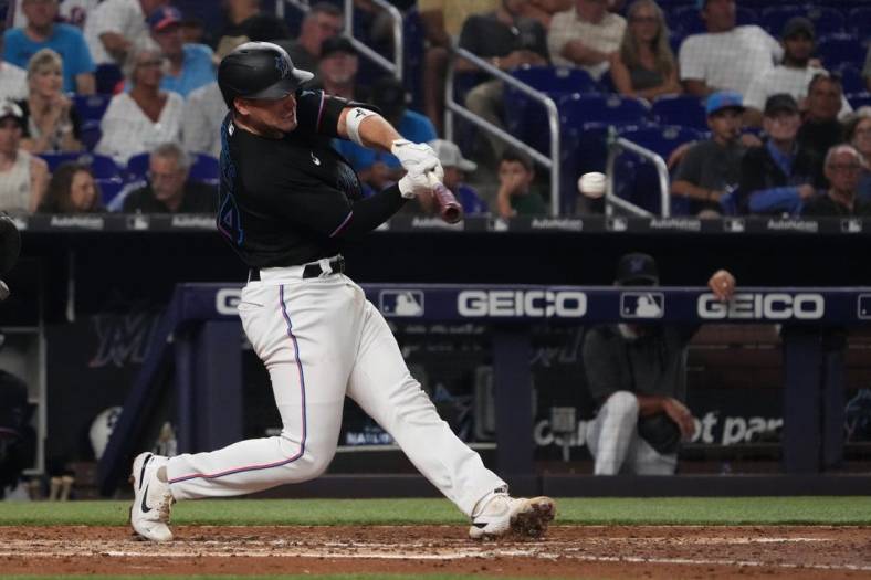 Sep 9, 2022; Miami, Florida, USA; Miami Marlins catcher Nick Fortes (54) singles in the fourth inning against the New York Mets at loanDepot park. Mandatory Credit: Jasen Vinlove-USA TODAY Sports
