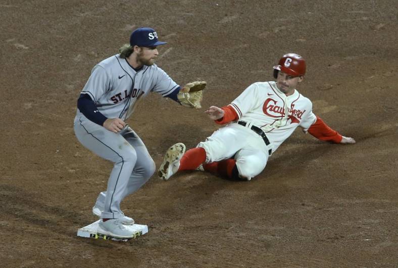 Sep 9, 2022; Pittsburgh, Pennsylvania, USA;  St. Louis Cardinals second baseman Brendan Donovan (left) takes a throw to force Pittsburgh Pirates center fielder Bryan Reynolds (right) out at second base during the fifth inning at PNC Park. Mandatory Credit: Charles LeClaire-USA TODAY Sports
