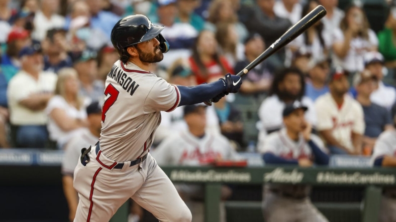 Sep 9, 2022; Seattle, Washington, USA; Atlanta Braves shortstop Dansby Swanson (7) hits a two-run home run against the Seattle Mariners during the first inning at T-Mobile Park. Mandatory Credit: Joe Nicholson-USA TODAY Sports