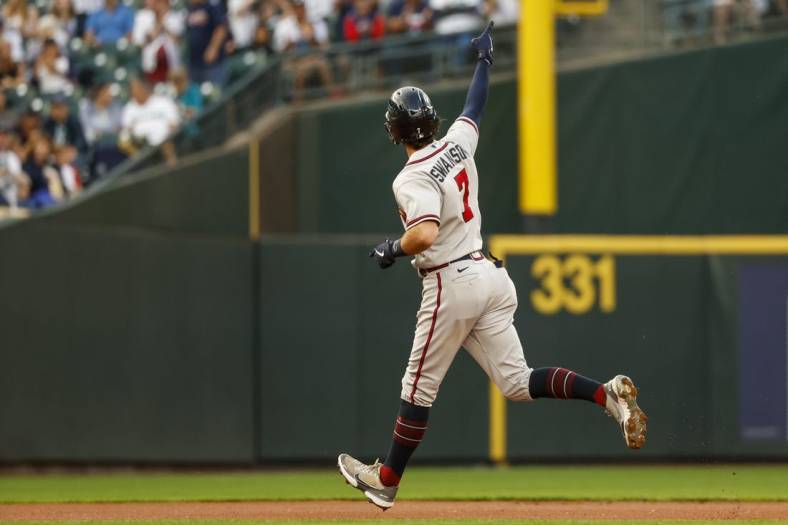 Sep 9, 2022; Seattle, Washington, USA; Atlanta Braves shortstop Dansby Swanson (7) celebrates as he runs the bases after hitting a two-run home run against the Seattle Mariners during the first inning at T-Mobile Park. Mandatory Credit: Joe Nicholson-USA TODAY Sports
