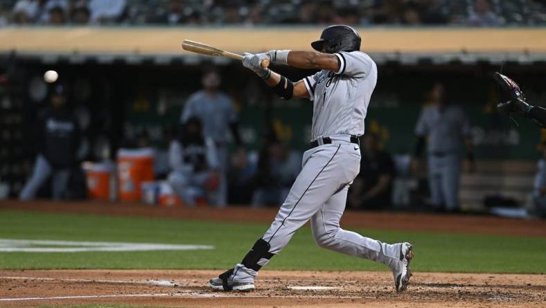 Sep 9, 2022; Oakland, California, USA; Chicago White Sox shortstop Elvis Andrus (1) reaches first base on an error by Oakland Athletics shortstop Nick Allen (2) during the fourth inning at RingCentral Coliseum. Mandatory Credit: Robert Edwards-USA TODAY Sports