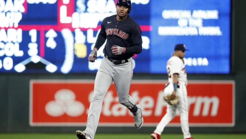 Sep 9, 2022; Minneapolis, Minnesota, USA;  Cleveland Guardians right fielder Oscar Gonzalez (39) hits a home run against Minnesota Twins at Target Field. Mandatory Credit: Bruce Kluckhohn-USA TODAY Sports