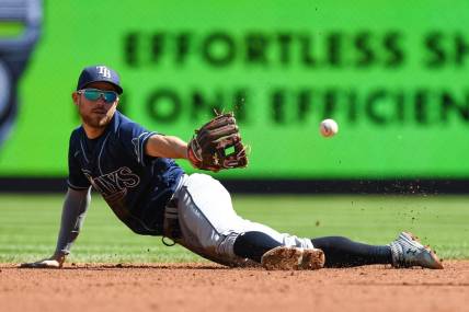 Sep 10, 2022; Bronx, New York, USA; Tampa Bay Rays second baseman Brandon Lowe (8) makes a diving catch and flips the ball to Tampa Bay Rays infielder Wander Franco (5) (not pictured) against the New York Yankees during the first inning at Yankee Stadium. Mandatory Credit: Dennis Schneidler-USA TODAY Sports