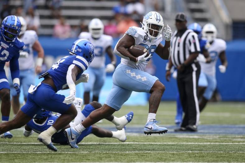 Sep 10, 2022; Atlanta, Georgia, USA; North Carolina Tar Heels tight end Kamari Morales (88) runs for a touchdown after a catch against the Georgia State Panthers in the first half at Center Parc Stadium. Mandatory Credit: Brett Davis-USA TODAY Sports