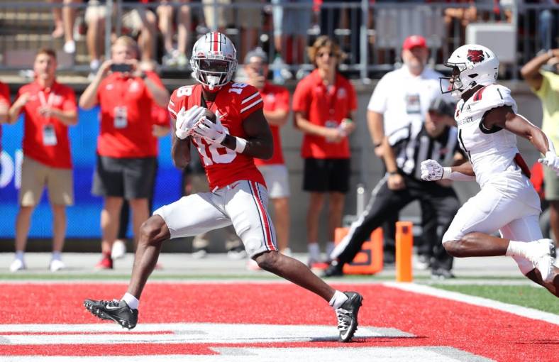Sep 10, 2022; Columbus, Ohio, USA;  Ohio State Buckeyes wide receiver Marvin Harrison Jr. (18) makes the touchdown catch during the second quarter against the Arkansas State Red Wolves at Ohio Stadium. Mandatory Credit: Joseph Maiorana-USA TODAY Sports