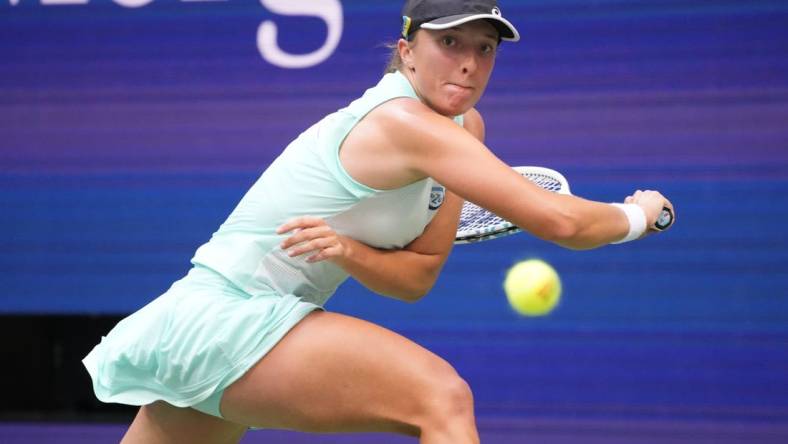 Sep 10, 2022; Flushing, NY, USA; Iga Swiatek (POL) reaches for a backhand against Ons Jabeur (TUN) (not pictured) in the women's singles final on day thirteen of the 2022 U.S. Open tennis tournament at USTA Billie Jean King Tennis Center. Mandatory Credit: Robert Deutsch-USA TODAY Sports