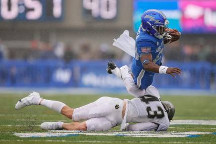 Sep 10, 2022; Colorado Springs, Colorado, USA; Air Force Falcons running back John Lee Eldridge III (24) is tackled by Colorado Buffaloes safety Trevor Woods (43) in the first quarter at Falcon Stadium. Mandatory Credit: Isaiah J. Downing-USA TODAY Sports
