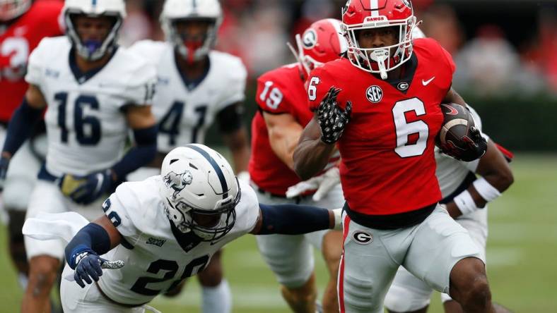 Georgia running back Kenny McIntosh (6) moves the ball down the field during the first half of a NCAA college football game between Samford and Georgia in Athens, Ga., on Saturday, Sept. 10, 2022.

News Joshua L Jones