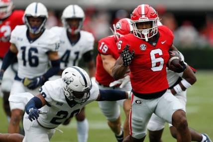 Georgia running back Kenny McIntosh (6) moves the ball down the field during the first half of a NCAA college football game between Samford and Georgia in Athens, Ga., on Saturday, Sept. 10, 2022.

News Joshua L Jones