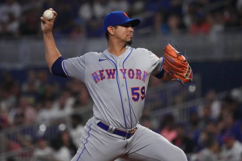 Sep 10, 2022; Miami, Florida, USA; New York Mets starting pitcher Carlos Carrasco (59) delivers a pitch in the first inning against the Miami Marlins at loanDepot park. Mandatory Credit: Jasen Vinlove-USA TODAY Sports