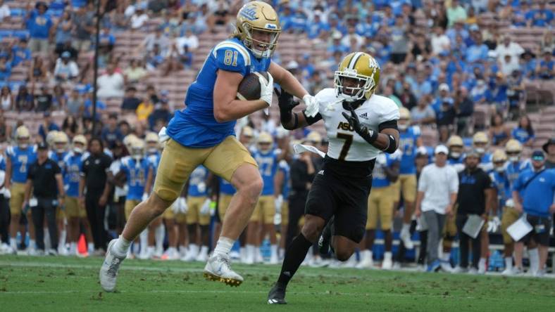 Sep 10, 2022; Pasadena, California, USA; UCLA Bruins tight end Hudson Habermehl (81) is pursued by Alabama State Hornets defensive back Jeffrey Scott Jr. (7) on a touchdown reception in the first half at Rose Bowl. Mandatory Credit: Kirby Lee-USA TODAY Sports