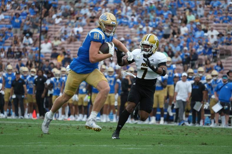 Sep 10, 2022; Pasadena, California, USA; UCLA Bruins tight end Hudson Habermehl (81) is pursued by Alabama State Hornets defensive back Jeffrey Scott Jr. (7) on a touchdown reception in the first half at Rose Bowl. Mandatory Credit: Kirby Lee-USA TODAY Sports