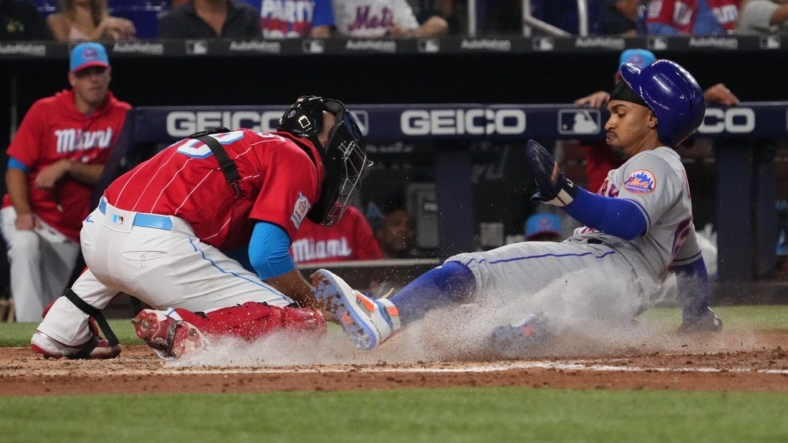 Sep 10, 2022; Miami, Florida, USA; New York Mets shortstop Francisco Lindor (12) scores a run in the third inning against the Miami Marlins at loanDepot park. Mandatory Credit: Jasen Vinlove-USA TODAY Sports