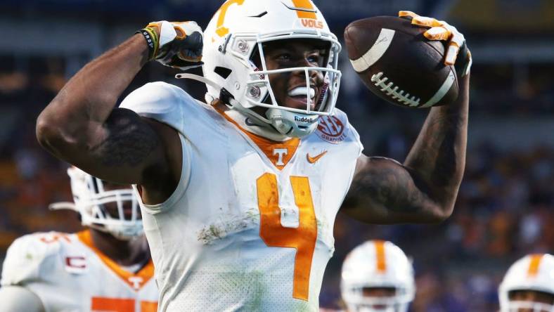 Sep 10, 2022; Pittsburgh, Pennsylvania, USA;  Tennessee Volunteers wide receiver Cedric Tillman (4) reacts after scoring the game winning touchdown against the Pittsburgh Panthers in overtime at Acrisure Stadium.  Tennessee won 34-27 in overtime. Mandatory Credit: Charles LeClaire-USA TODAY Sports