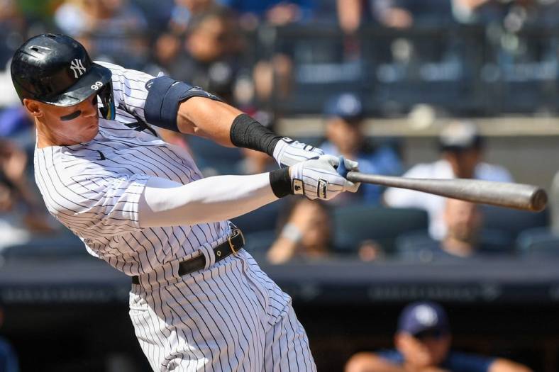 Sep 10, 2022; Bronx, New York, USA;  New York Yankees center fielder Aaron Judge (99) hits a single against the Tampa Bay Rays during the sixth inning at Yankee Stadium. Mandatory Credit: Dennis Schneidler-USA TODAY Sports