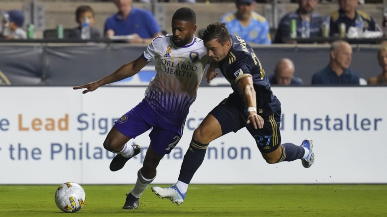 Sep 10, 2022; Chester, Pennsylvania, USA; Orlando City defender Ruan (2) controls the ball against Philadelphia Union defender Kai Wagner (27) in the first half at Subaru Park. Mandatory Credit: Mitchell Leff-USA TODAY Sports