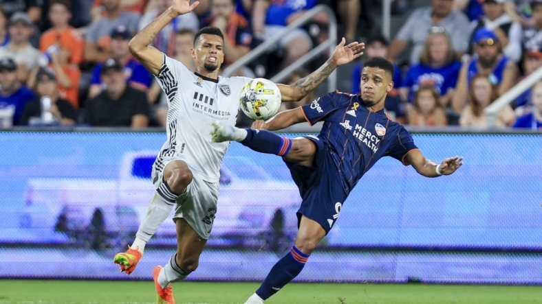 Sep 10, 2022; Cincinnati, Ohio, USA; San Jose Earthquakes Rodrigues (left) battles for the ball against FC Cincinnati forward Brenner (9) in the first half at TQL Stadium. Mandatory Credit: Aaron Doster-USA TODAY Sports
