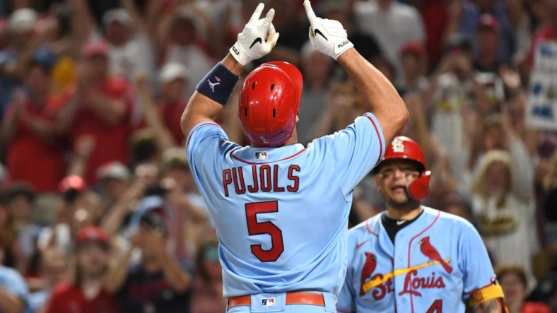 Sep 10, 2022; Pittsburgh, Pennsylvania, USA;  St. Louis Cardinals Albert Pujols (5) celebrates near teammate Yadier Molina (4) after hitting a two-run home run against the Pittsburgh Pirates in the sixth inning at PNC Park. It was the career home run 696 for Pujols. Mandatory Credit: Philip G. Pavely-USA TODAY Sports