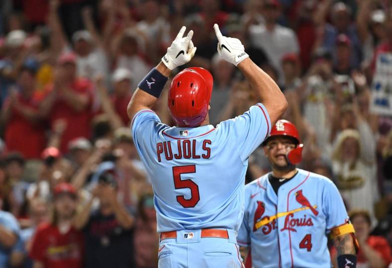 Sep 10, 2022; Pittsburgh, Pennsylvania, USA;  St. Louis Cardinals Albert Pujols (5) celebrates near teammate Yadier Molina (4) after hitting a two-run home run against the Pittsburgh Pirates in the sixth inning at PNC Park. It was the career home run 696 for Pujols. Mandatory Credit: Philip G. Pavely-USA TODAY Sports