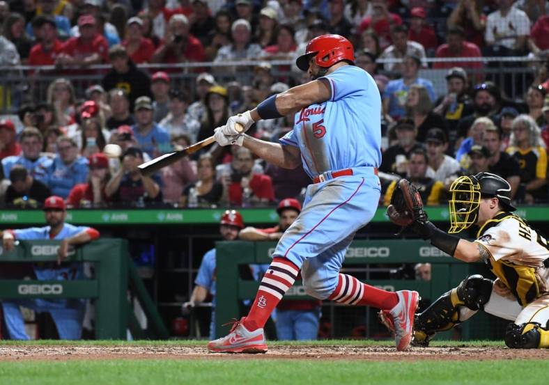 Sep 10, 2022; Pittsburgh, Pennsylvania, USA;  St. Louis Cardinals Albert Pujols (5) hits a two-run home run against the Pittsburgh Pirates in the sixth inning at PNC Park. It was the career home run 696 for Pujols. Mandatory Credit: Philip G. Pavely-USA TODAY Sports
