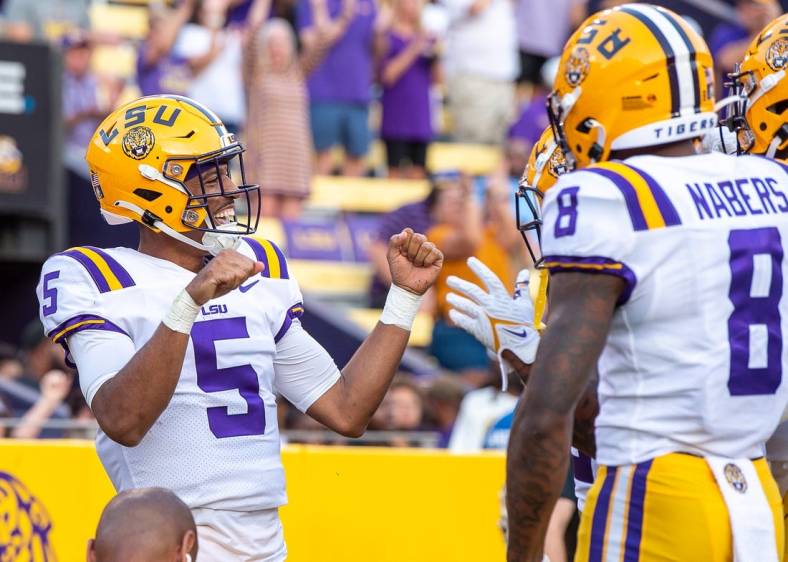 Sep 10, 2022; Baton Rouge, Louisiana, USA;  LSU Tigers quarterback Jayden Daniels (5) celebrates after scoring a touchdown against the Southern Jaguars at Tiger Stadium. Mandatory Credit: Scott Clause-USA TODAY Sports