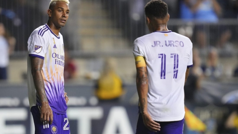Sep 10, 2022; Chester, Pennsylvania, USA; Orlando City defender Antonio Carlos (25) and midfielder Junior Urso (11) look on after a goal by the Philadelphia Union in the second half at Subaru Park. Mandatory Credit: Mitchell Leff-USA TODAY Sports