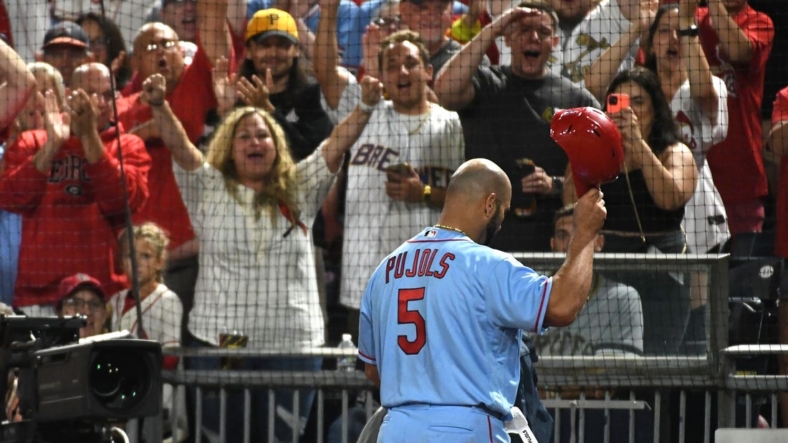 Sep 10, 2022; Pittsburgh, Pennsylvania, USA;  St. Louis Cardinals  Albert Pujols (5) tips his helmet to the crowd after leaving the game against the Pittsburgh Pirates in the eighth inning at PNC Park. Mandatory Credit: Philip G. Pavely-USA TODAY Sports