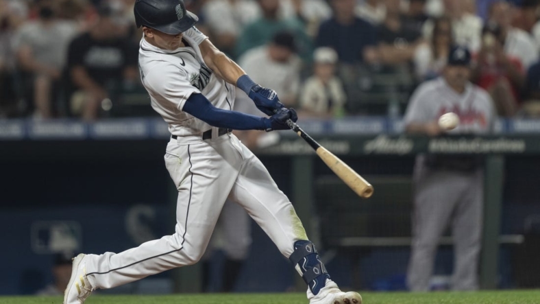 Sep 10, 2022; Seattle, Washington, USA; Seattle Mariners leftfielder Sam Haggerty (0) hits a solo home run off Atlanta Braves starting pitcher Max Fried (54) during the fifth inning at T-Mobile Park. Mandatory Credit: Stephen Brashear-USA TODAY Sports