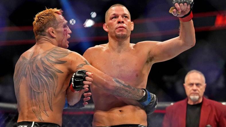 Sep 10, 2022; Las Vegas, Nevada, USA; Nate Diaz (red gloves) fights Tony Ferguson (blue gloves) during UFC 279 at T-Mobile Arena. Mandatory Credit: Joe Camporeale-USA TODAY Sports