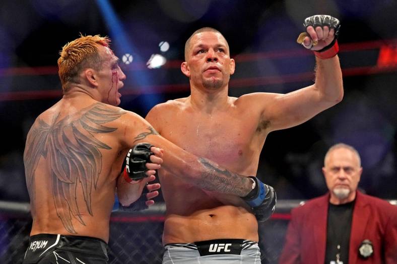 Sep 10, 2022; Las Vegas, Nevada, USA; Nate Diaz (red gloves) fights Tony Ferguson (blue gloves) during UFC 279 at T-Mobile Arena. Mandatory Credit: Joe Camporeale-USA TODAY Sports