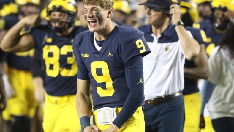 Michigan quarterback J.J. McCarthy celebrates on the sidelines during the second half of the 56-10 win over Hawaii on Saturday, Sept. 10, 2022, in Ann Arbor.

Mich2