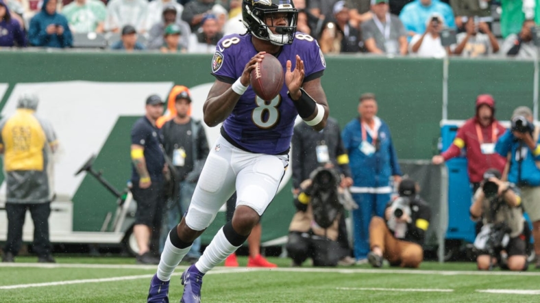 Sep 11, 2022; East Rutherford, New Jersey, USA; Baltimore Ravens quarterback Lamar Jackson (8) drops back to pass against the New York Jets during the first half at MetLife Stadium. Mandatory Credit: Vincent Carchietta-USA TODAY Sports