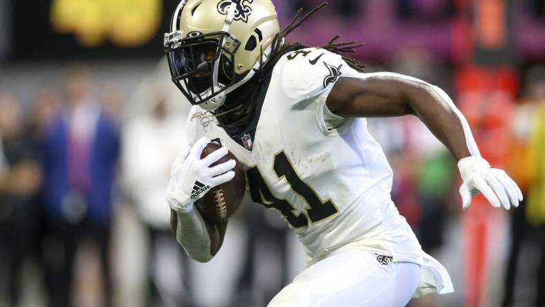 Sep 11, 2022; Atlanta, Georgia, USA; New Orleans Saints running back Alvin Kamara (41) runs the ball against the Atlanta Falcons in the first quarter at Mercedes-Benz Stadium. Mandatory Credit: Brett Davis-USA TODAY Sports