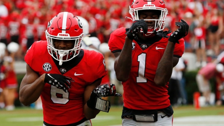 Georgia running back Kenny McIntosh (6) celebrates with Georgia wide receiver Marcus Rosemy-Jacksaint (1) after scoring touchdown during the first half of a college football game between Samford and Georgia in Athens, Ga., on Saturday, Sept. 10, 2022.Syndication Online Athens