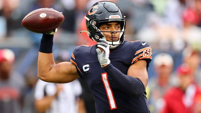 Sep 11, 2022; Chicago, Illinois, USA; Chicago Bears quarterback Justin Fields (1) drops back to pass against the San Francisco 49ers during the first half at Soldier Field. Mandatory Credit: Mike Dinovo-USA TODAY Sports