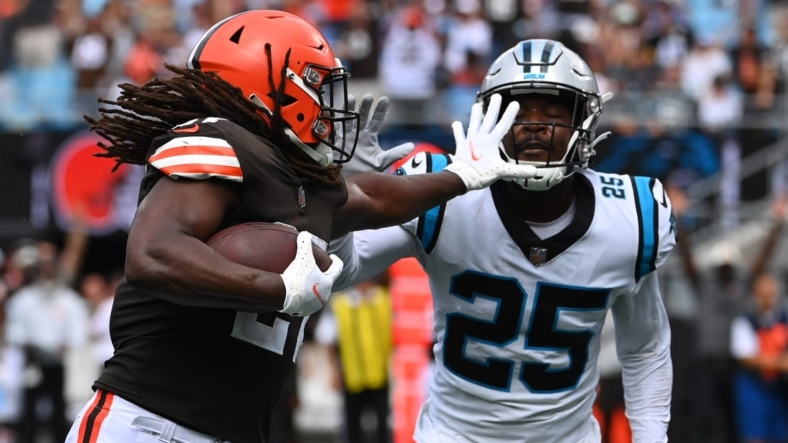 Sep 11, 2022; Charlotte, North Carolina, USA; Carolina Panthers safety Marquise Blair (27) runs for a touchdown   as Carolina Panthers Xavier Woods (25) defends in the second quarter at Bank of America Stadium. Mandatory Credit: Bob Donnan-USA TODAY Sports