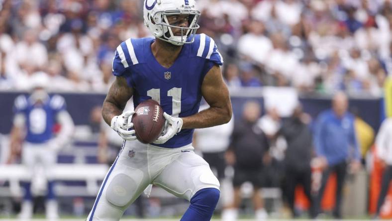 Sep 11, 2022; Houston, Texas, USA; Indianapolis Colts wide receiver Michael Pittman Jr. (11) makes a reception during the second quarter against the Houston Texans at NRG Stadium. Mandatory Credit: Troy Taormina-USA TODAY Sports