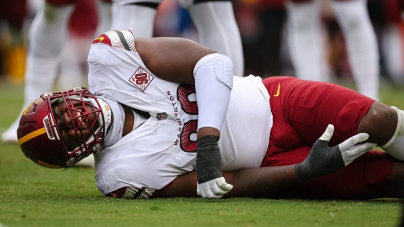 Sep 11, 2022; Landover, Maryland, USA; Washington Commanders defensive tackle Phidarian Mathis (98) reacts after being injured against the Jacksonville Jaguars during the first half at FedExField. Mandatory Credit: Scott Taetsch-USA TODAY Sports