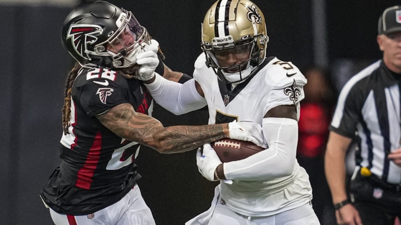 Sep 11, 2022; Atlanta, Georgia, USA; New Orleans Saints wide receiver Jarvis Landry (5) runs against Atlanta Falcons cornerback Mike Ford (28) during the first half at Mercedes-Benz Stadium. Mandatory Credit: Dale Zanine-USA TODAY Sports