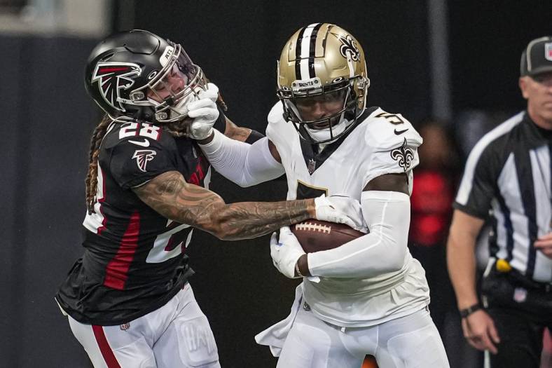 Sep 11, 2022; Atlanta, Georgia, USA; New Orleans Saints wide receiver Jarvis Landry (5) runs against Atlanta Falcons cornerback Mike Ford (28) during the first half at Mercedes-Benz Stadium. Mandatory Credit: Dale Zanine-USA TODAY Sports