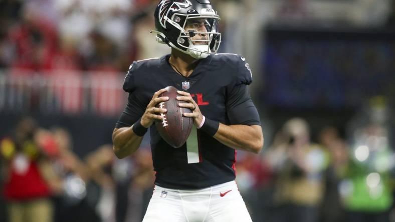 Sep 11, 2022; Atlanta, Georgia, USA; Atlanta Falcons quarterback Marcus Mariota (1) drops back to pass against the New Orleans Saints in the first quarter at Mercedes-Benz Stadium. Mandatory Credit: Brett Davis-USA TODAY Sports