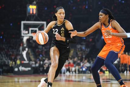 Sep 11, 2022; Las Vegas, Nevada, USA; Las Vegas Aces forward A'ja Wilson (22) drives the ball against Connecticut Sun forward Jonquel Jones (35) in the first quarter during game one of the 2022 WNBA Finals at Michelob Ultra Arena. Mandatory Credit: Lucas Peltier-USA TODAY Sports