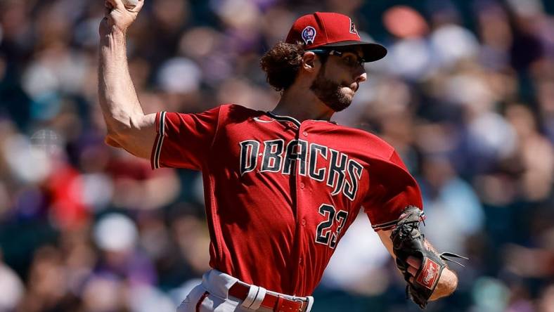 Sep 11, 2022; Denver, Colorado, USA; Arizona Diamondbacks starting pitcher Zac Gallen (23) pitches in the first inning against the Colorado Rockies at Coors Field. Mandatory Credit: Isaiah J. Downing-USA TODAY Sports