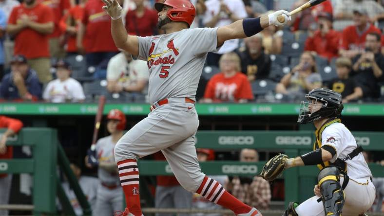 Sep 11, 2022; Pittsburgh, Pennsylvania, USA;  St. Louis Cardinals first baseman Albert Pujols (5) hits a two-run home run against the Pittsburgh Pirates during the ninth inning at PNC Park. The home run is the 697th home run of Pujols' career giving him sole possession of fourth place all time on the MLB career home run list. The Cardinals won 4-3. Mandatory Credit: Charles LeClaire-USA TODAY Sports