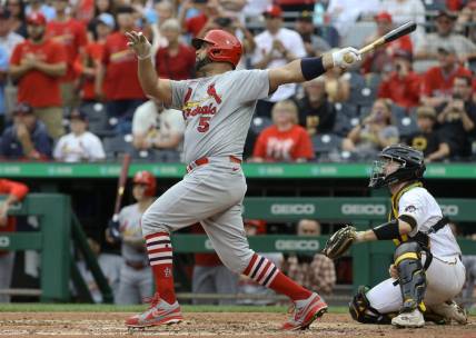 Sep 11, 2022; Pittsburgh, Pennsylvania, USA;  St. Louis Cardinals first baseman Albert Pujols (5) hits a two-run home run against the Pittsburgh Pirates during the ninth inning at PNC Park. The home run is the 697th home run of Pujols' career giving him sole possession of fourth place all time on the MLB career home run list. The Cardinals won 4-3. Mandatory Credit: Charles LeClaire-USA TODAY Sports
