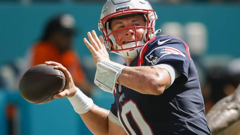 Sep 11, 2022; Miami Gardens, Florida, USA; New England Patriots quarterback Mac Jones (10) throws the football during the fourth quarter against the Miami Dolphins at Hard Rock Stadium. Mandatory Credit: Sam Navarro-USA TODAY Sports